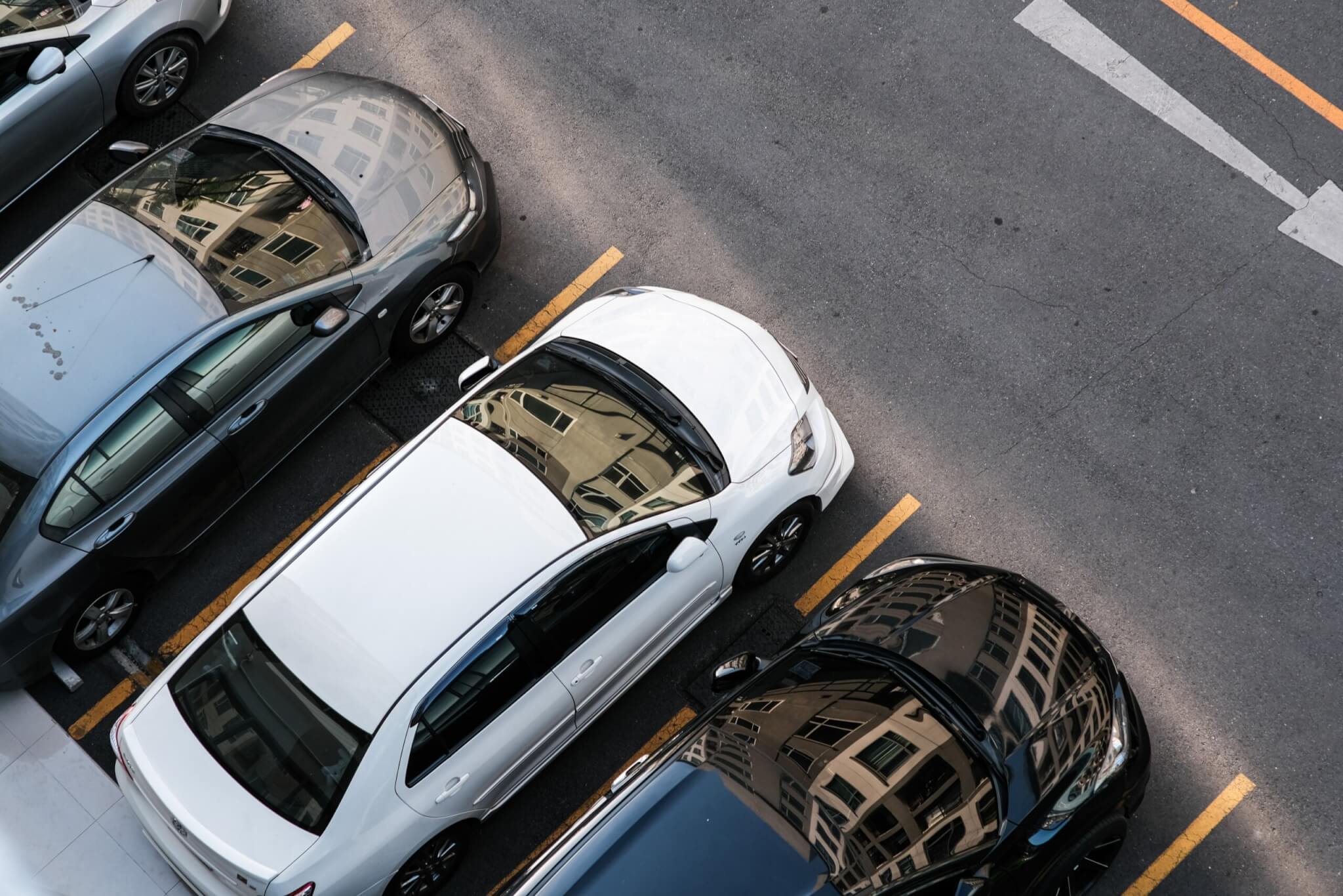 Colorful rental car parking lot aerial view