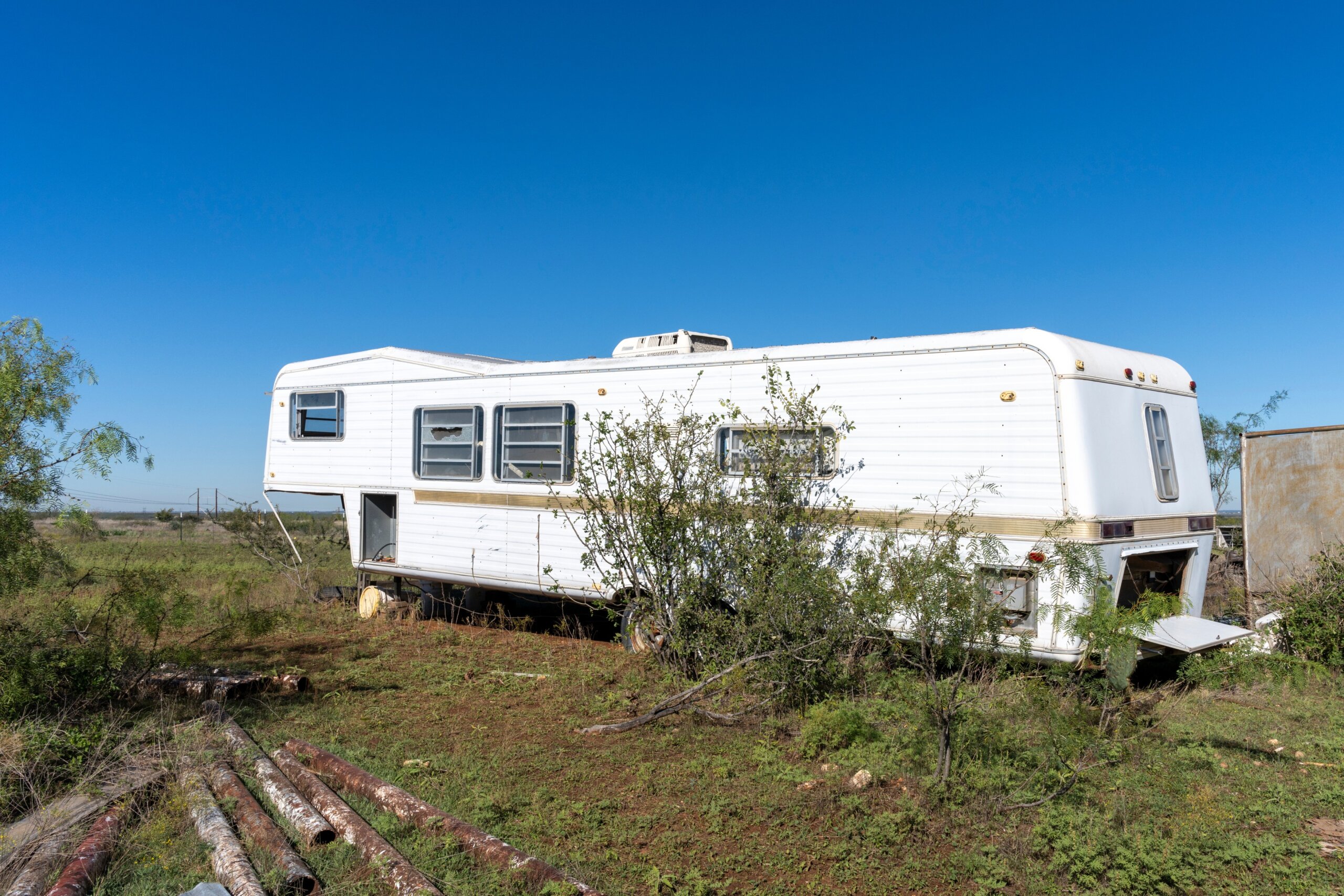 An old recreational vehicle abandoned in a Texas field
