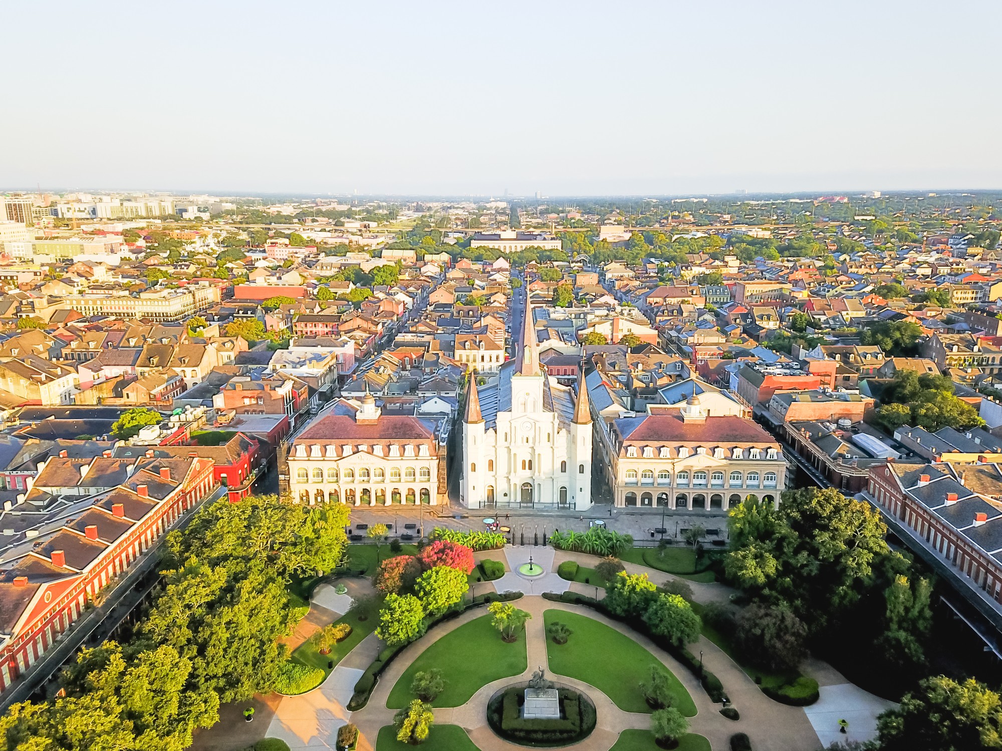 Aerial view of Jackson Square with Saint Louis Cathedral church and surrounding extant historical buildings from French Quarter in morning. The historic district section of the city of New Orleans.
