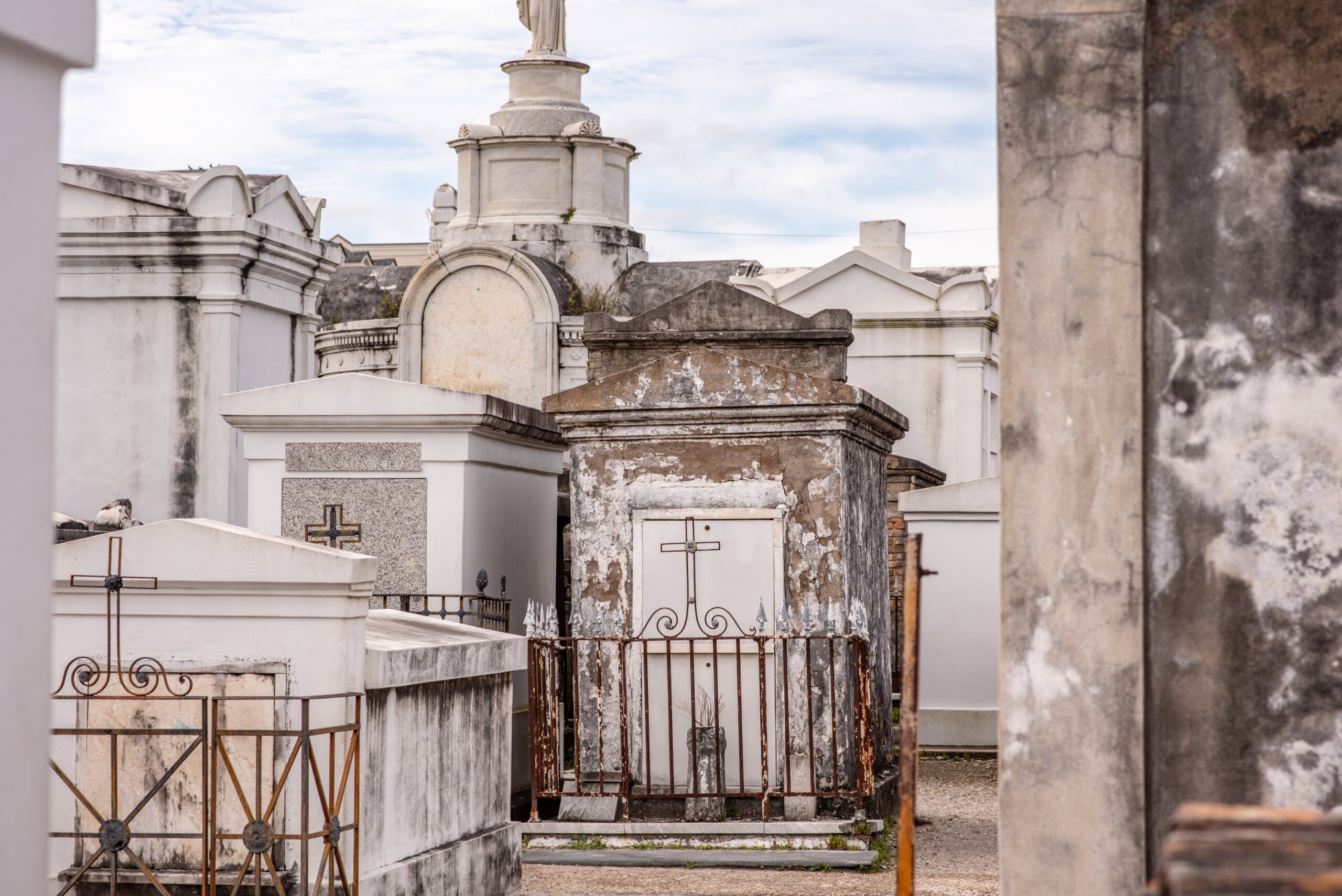 Above-ground tombs in St. Louis Cemetery No. 1 in New Orleans, Louisiana, featuring historic graves and the reputed resting place of voodoo queen Marie Laveau.