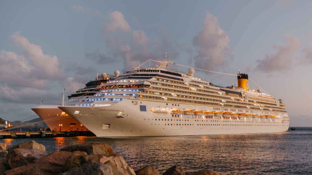 two large cruise ships docked at the port