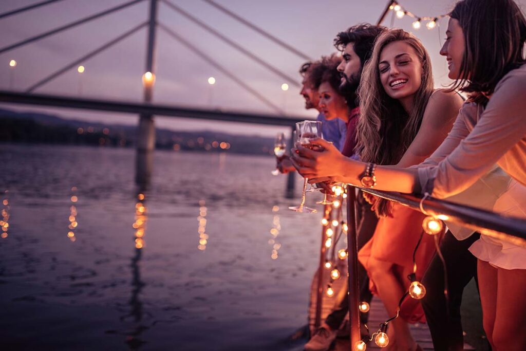 Group of friends enjoying a sail away party on a cruise ship