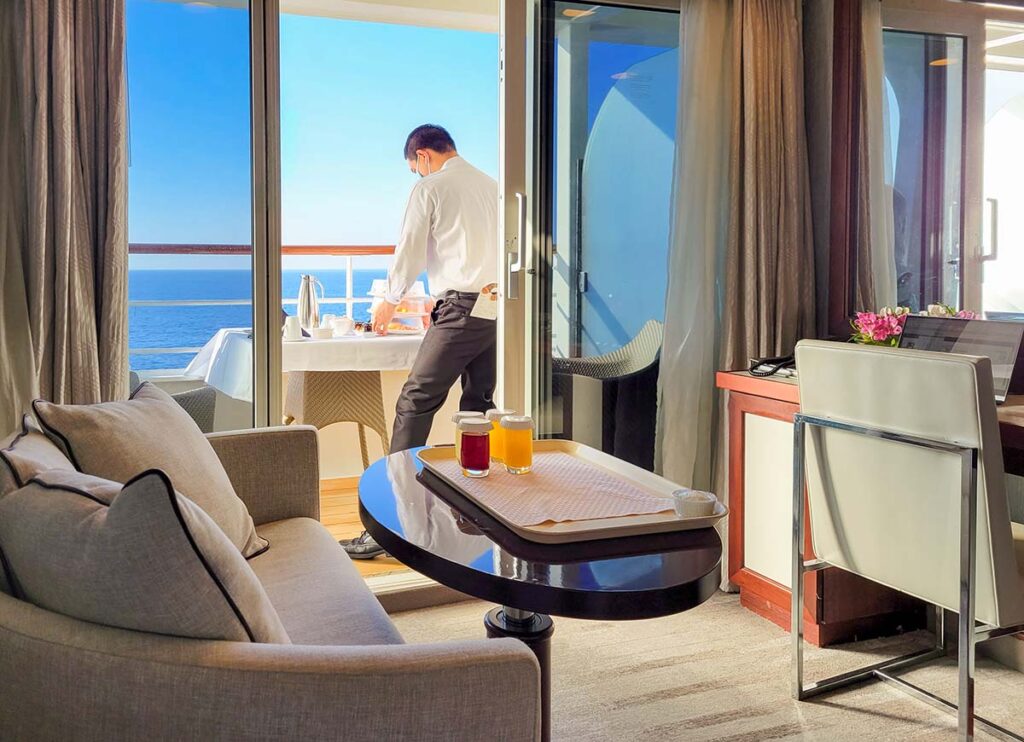 Man on the balcony of a cruise ship stateroom