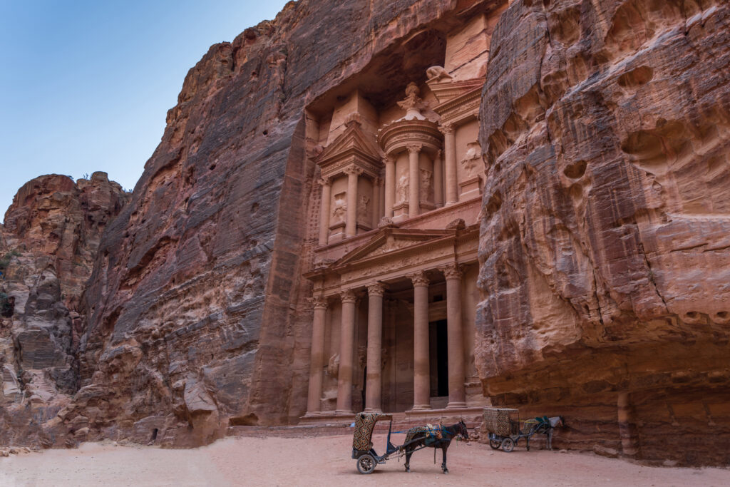 Horse with trailer in front of petra