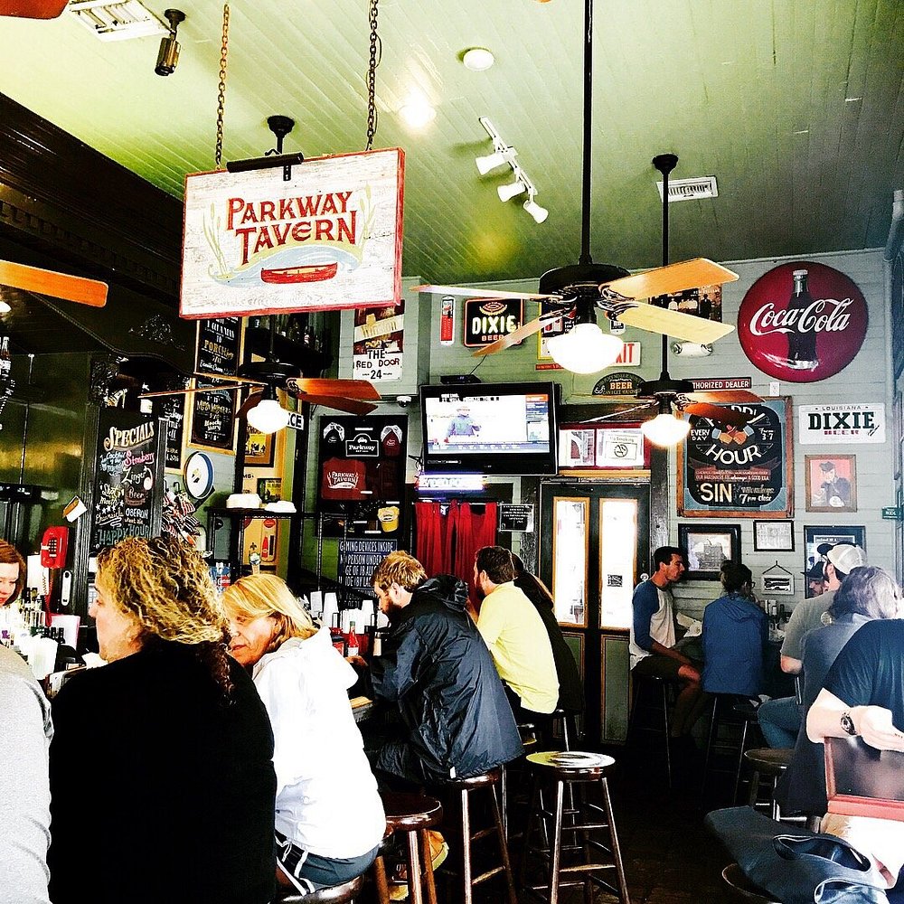 Interior of Parkway Bakery & Tavern in New Orleans, featuring rustic decor, wooden tables, and a casual, welcoming atmosphere.