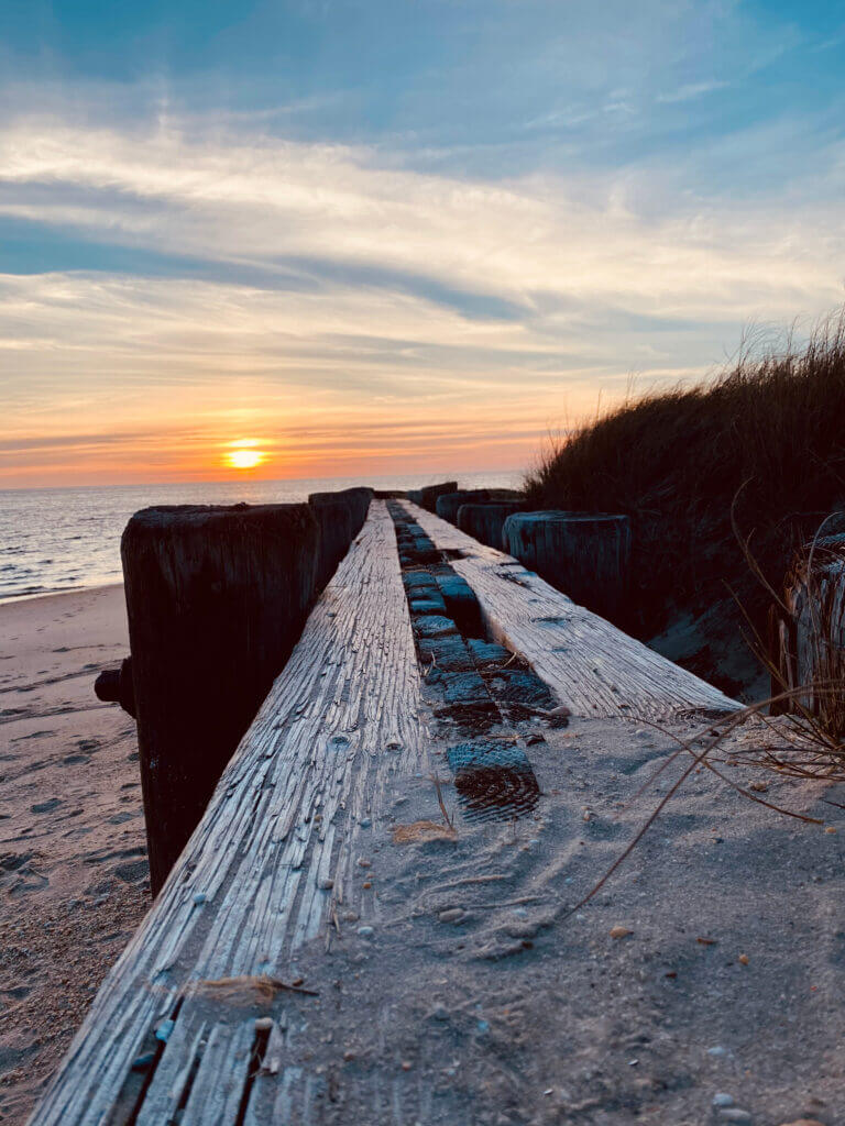 A low angle view of the late afternoon sunset over the Delaware Bay from the North Cape May shore.