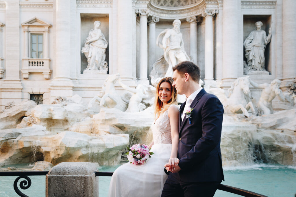 Bride and groom wedding poses in front of Trevi Fountain (Fontana di Trevi), Rome, Italy