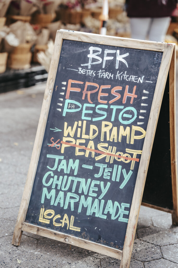 Chalkboard in street with inscription of products