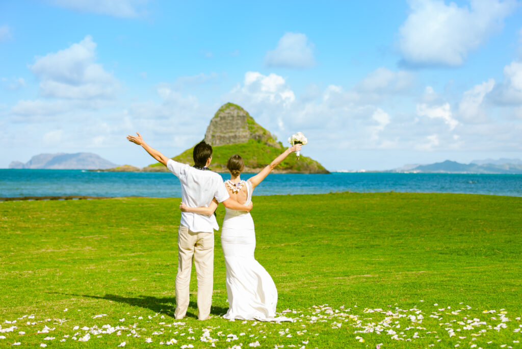 Dream wedding. Just married bride and groom celebrating. Location Hawaii.
