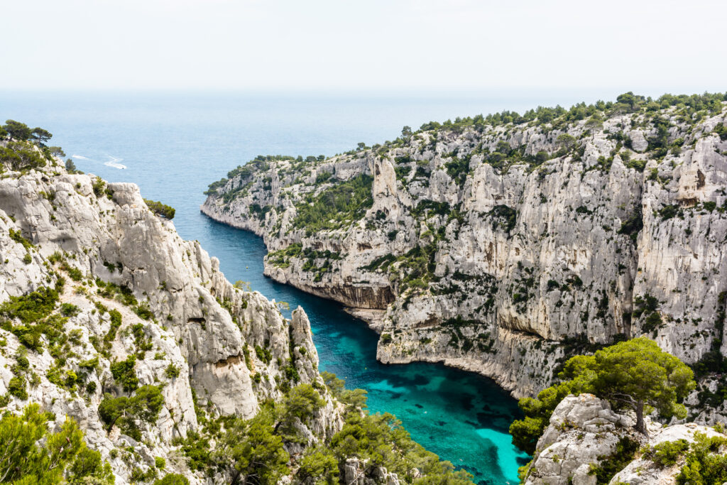 General view of the calanque of En-Vau, a long and narrow natural creek with crystal clear water on the french mediterranean coast, part of the Calanques National Park between Marseille and Cassis.