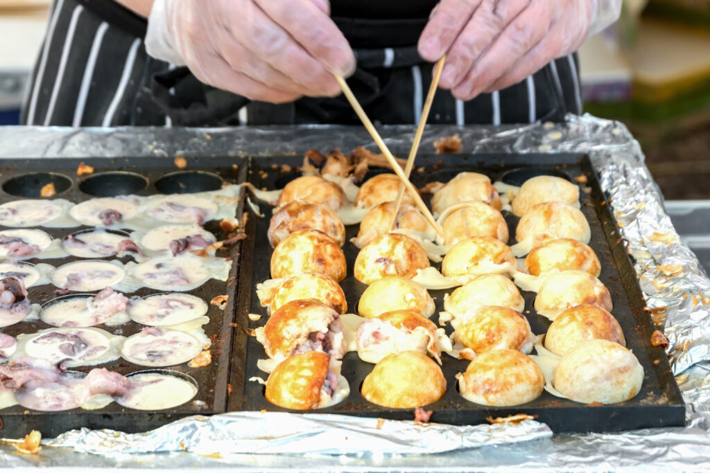 Process to Cooking Takoyaki on hot pan Famous food Osaka Japan street food