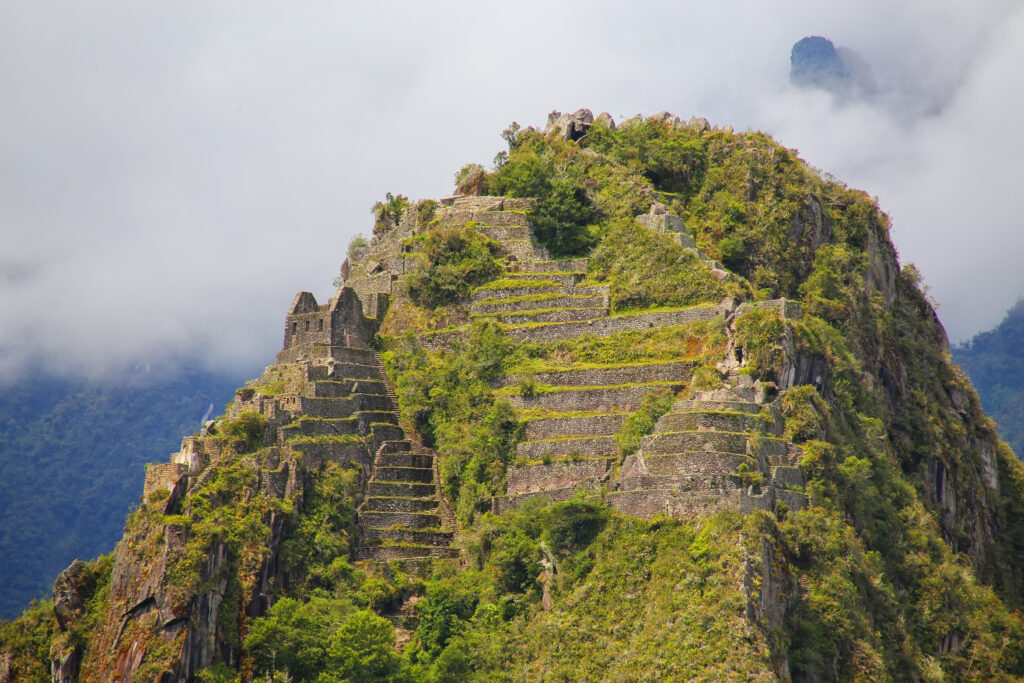 Terraces and buildings on Huayna Picchu mountain at Machu Picchu