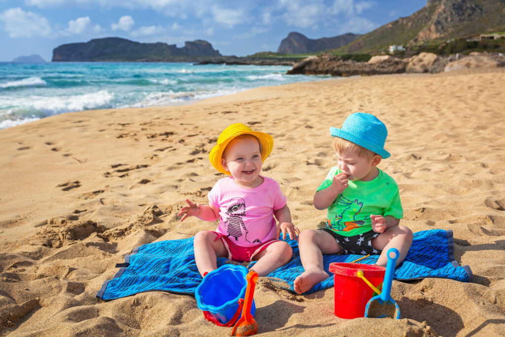 Twins on the beach holidays in Greece