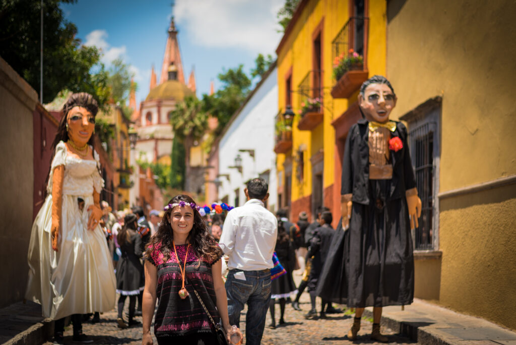 Woman in the Beautifull town of San Miguel de Allende celebrating a wedding with mojigangas in a callejoneada