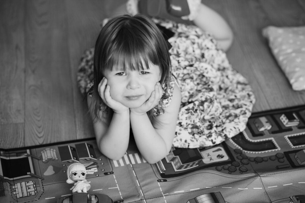 A young girl looking pensive