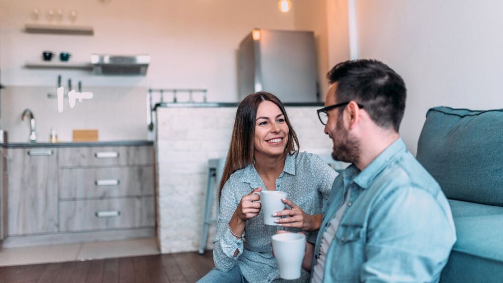 Couple talking to each other on a couch 