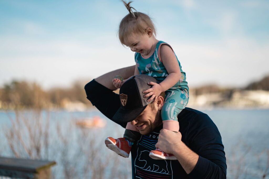 Father carrying his daughter