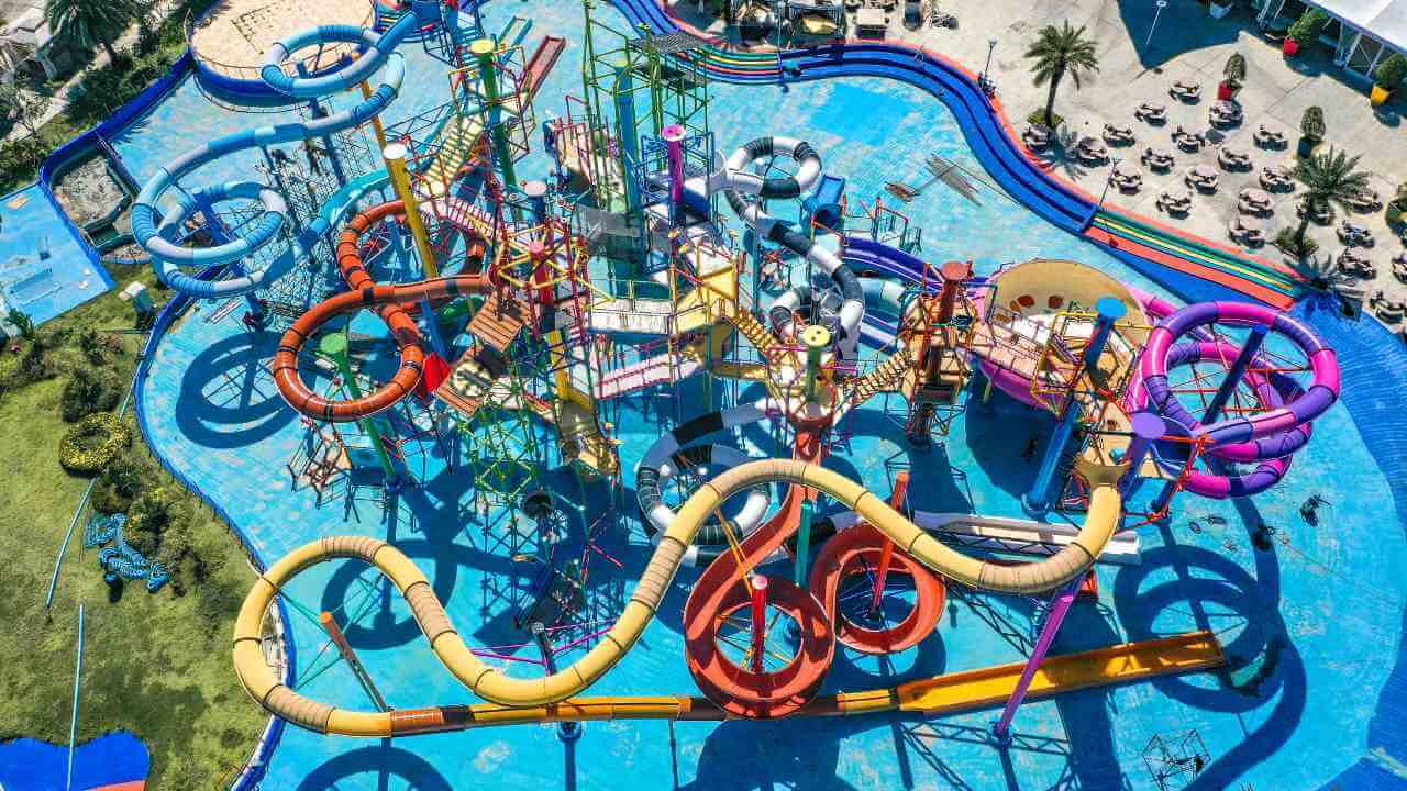 an aerial view of an amusement park with water slides