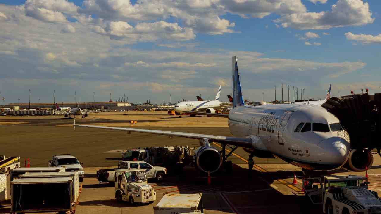 an airplane is parked on the tarmac at an airport