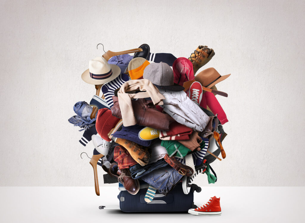 Big heap of different clothes and shoes