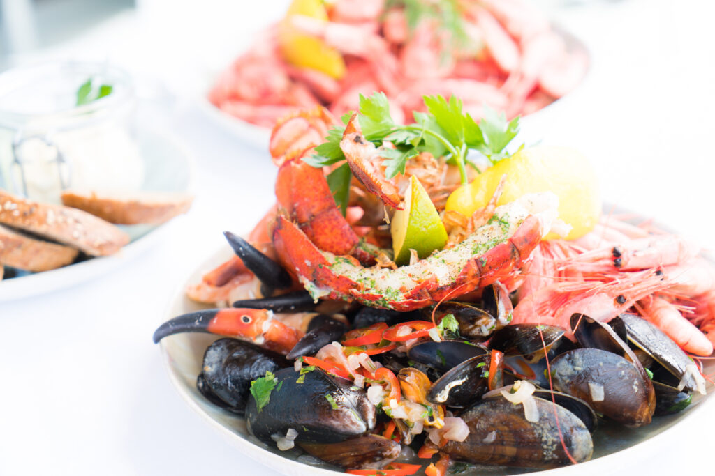 Bowl of mussels and shrimps selective focus photography