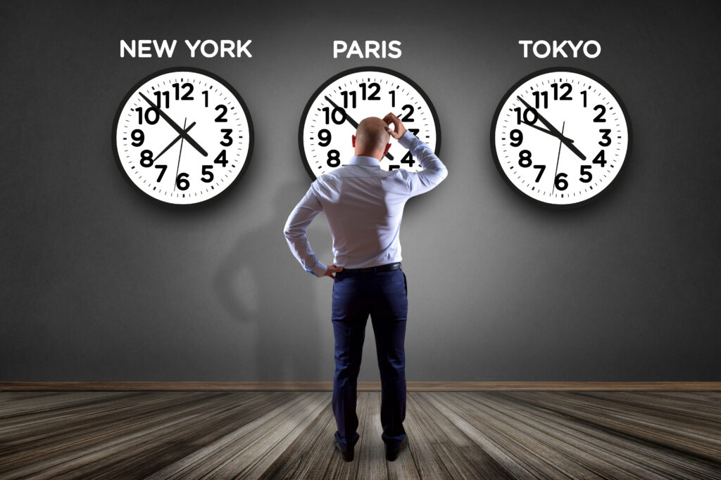 Businessman in front of a wallwith clocks of different country - Jetlag concept