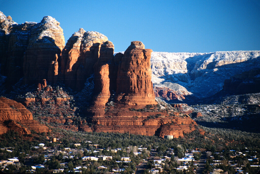 Coffee Pot Rock at Sunrise on Crystal Clear Winter Morning in Sedona, Arizona, USA.  Red Rocks Secret Mountain Wilderness Area in background.