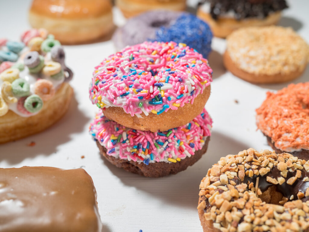 Colorful Portland donuts. Doughnuts from Portland, Oregon. Tourist attraction donut food.