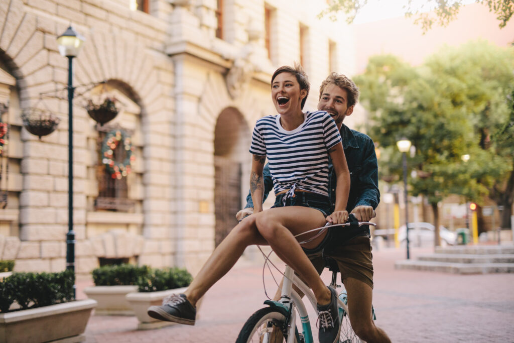 Couple enjoying a bicycle ride in the city