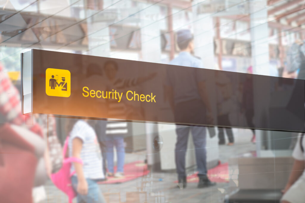 Double exposure of security check airport sign ,Airport security check at gates with metal detector and scanner