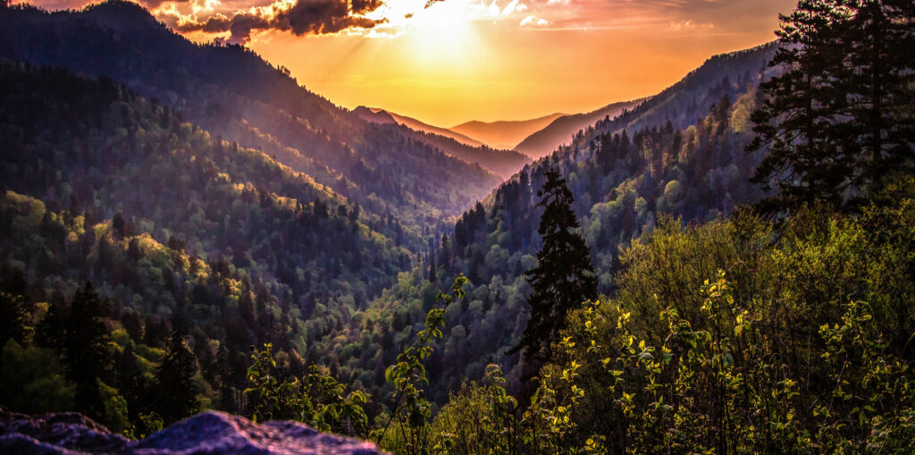 Great Smoky Mountain Sunset Landscape Panorama. Sunset horizon over the Great Smoky Mountains from Morton overlook on the Newfound Gap Road in Gatlinburg, Tennessee.
