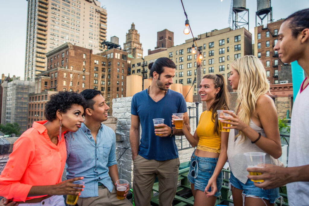 Group of friends having party on a rooftop