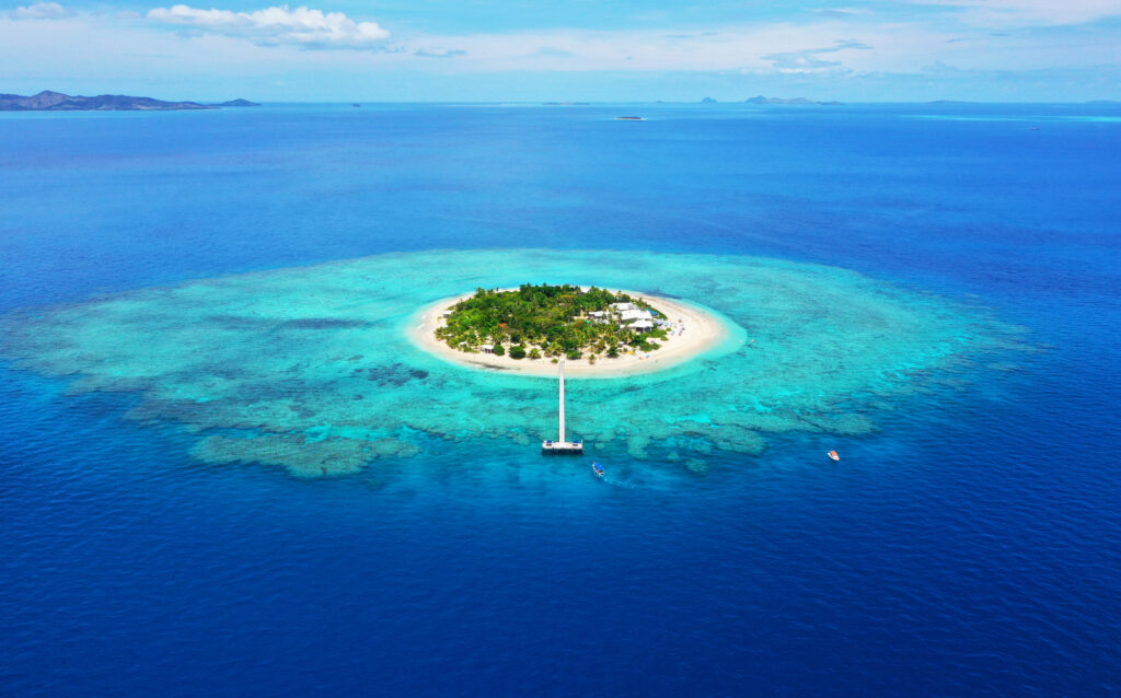 Paradise Island. Aerial View of beautiful Mala Mala Island, Fiji, Pacific Ocean. Drone shot.