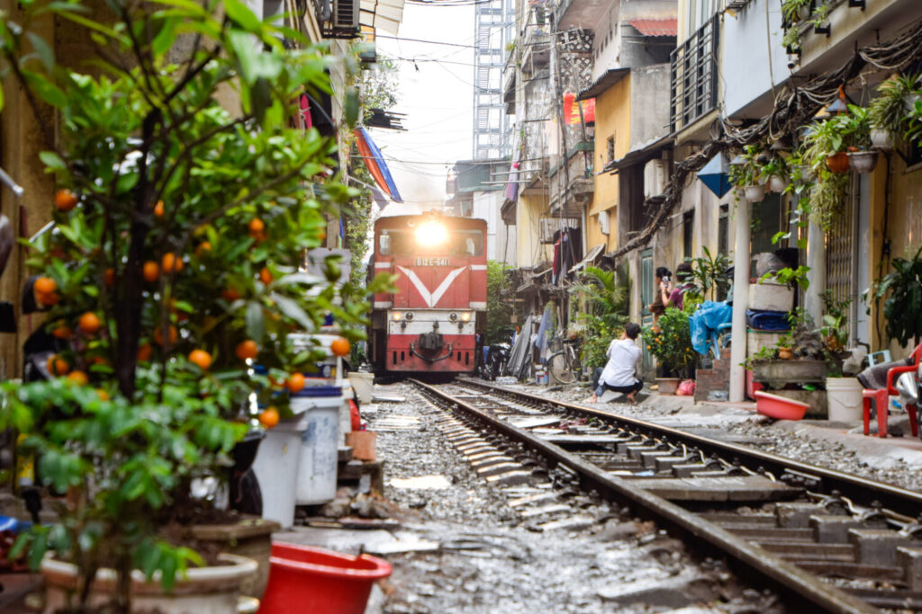 The wonder of the train passing through the houses. Popular place and one of the main attraction of Hanoi, Vietnam City. Street Train, Hanoi Vietnam, Community, Livelihoods of the Vietnamese people.