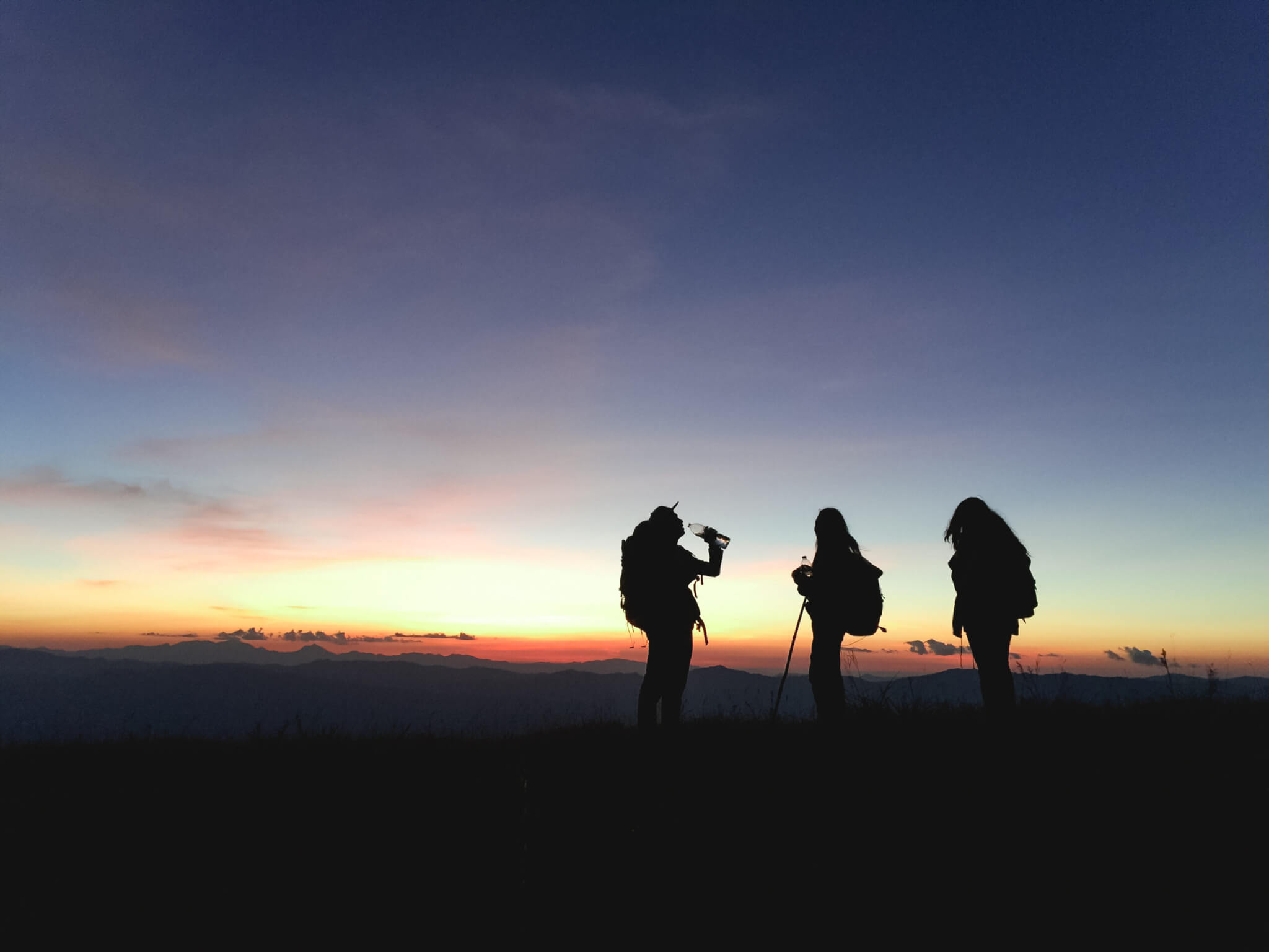 Silhouette of three people