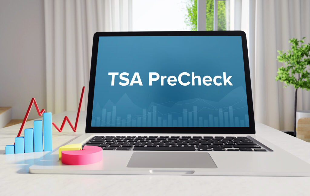 TSA PreCheck – Statistics/Business. Laptop in the office with term on the Screen. Finance/Economy.