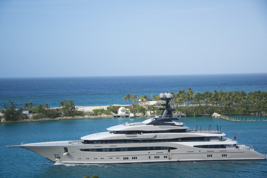 White and blue yacht on body of water