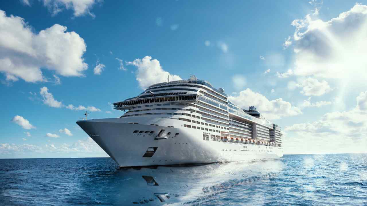 a large cruise ship in the ocean on a sunny day