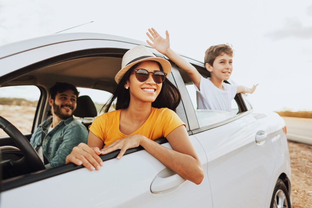 Family road trip. Latin family traveling locally by car.