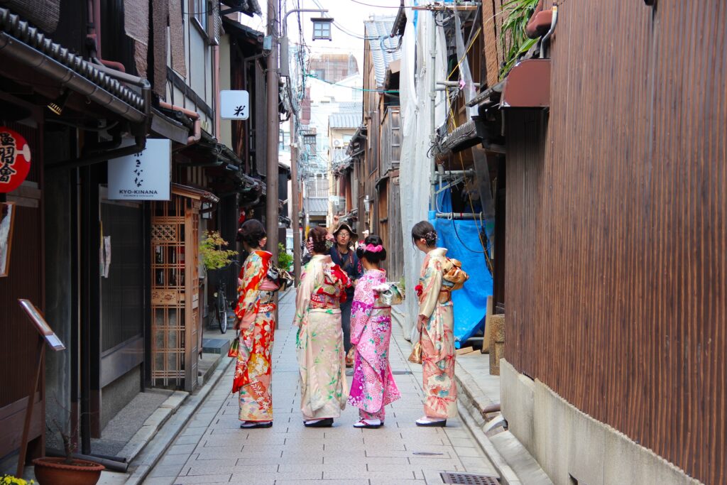 four women wearing geisha costumes at daytime