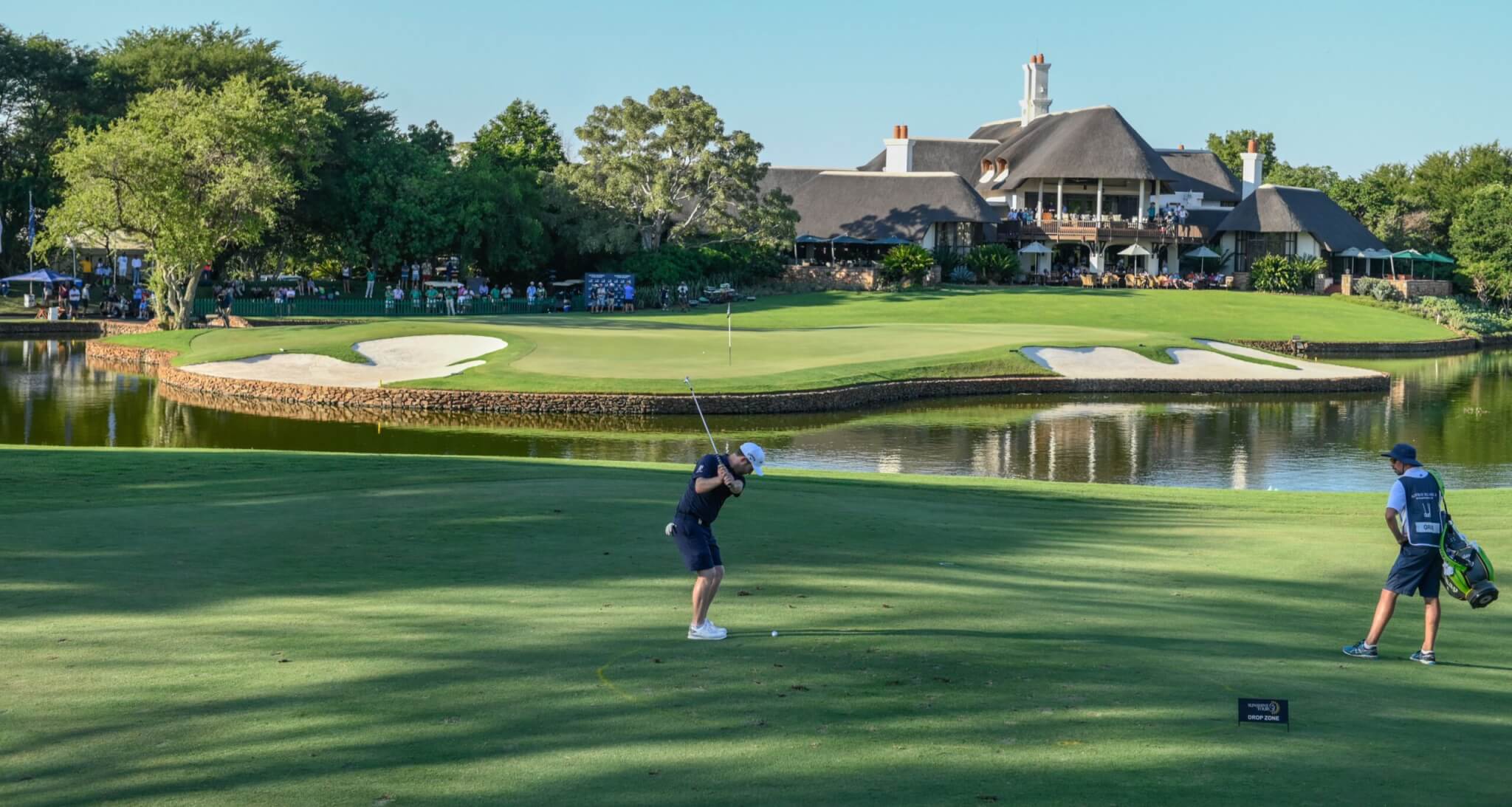 Branden Grace of South Africa plays a shot from the drop zone to the 18th green during the third day of the Alfred Dunhill Championship at the Leopard Creek Golf Course in Nelspruit, South Africa, 29 November 2019.