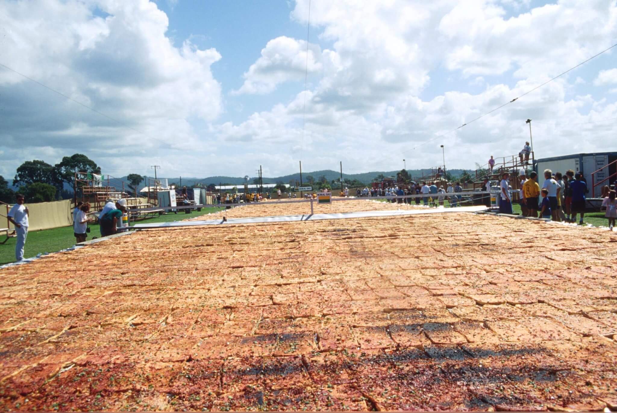 THE BIGGEST PIZZA IN THE WORLD IS COVERING A FOOTBALL PITCH