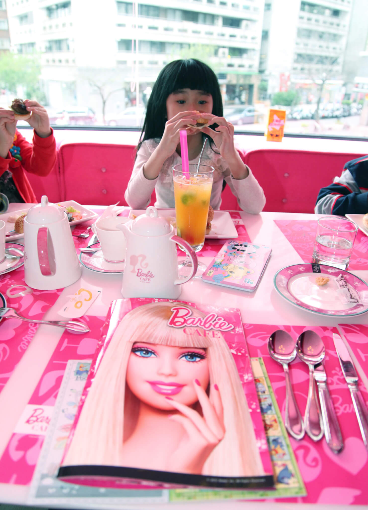 A Girl Drinks Fruit Juice at the World's First Barbie Restaurant Called Barbie Cafe in Taipei Taiwan 02 February 2013 Us Boy Company Mattel Inc Licensed a Taiwan Interior Design Firm to Launch Barbie Cafe on 30 January 2013 For Barbie Fans Sinlaku Taiwan Co Ltd Which Runs the Restaurant Said It Plans to Open More Barbie Cafes in and Outside Taiwan with the First Overseas Barbie Cafe Planned in Shanghai China Taiwan Taipei