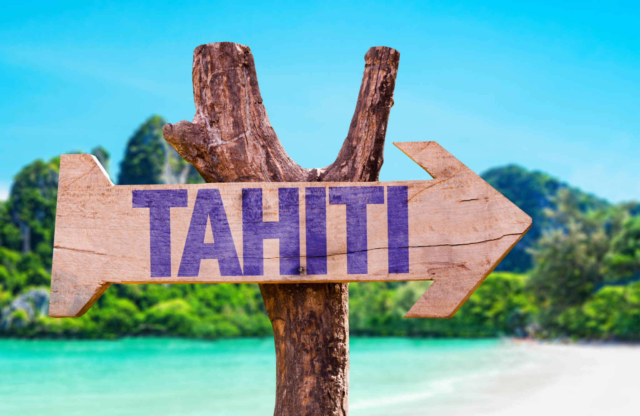 Tahiti wooden sign with beach background