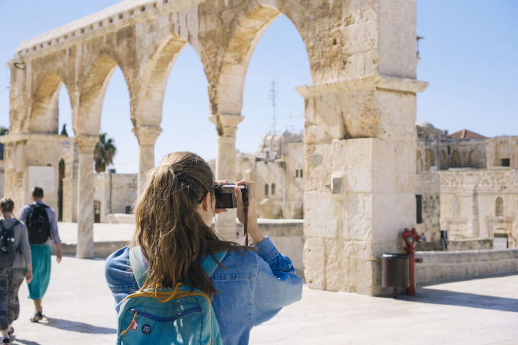 Woman taking pictures of ruins