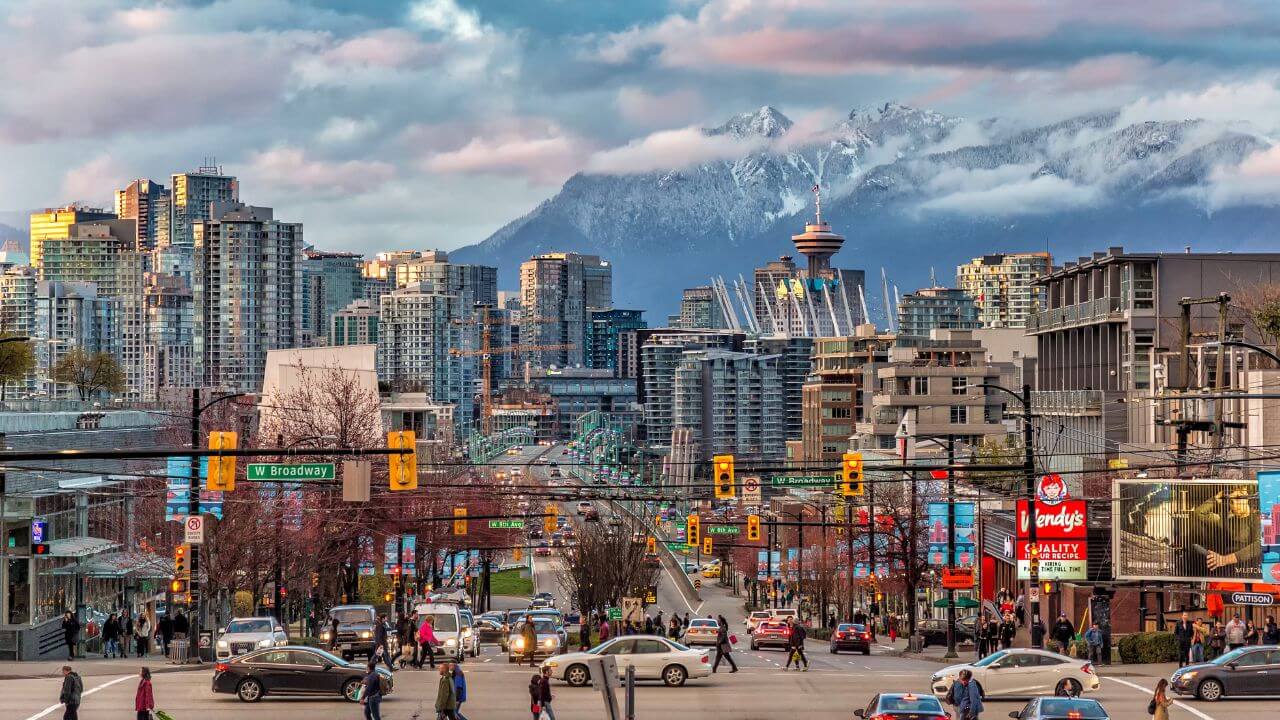 the city of vancouver with mountains in the background