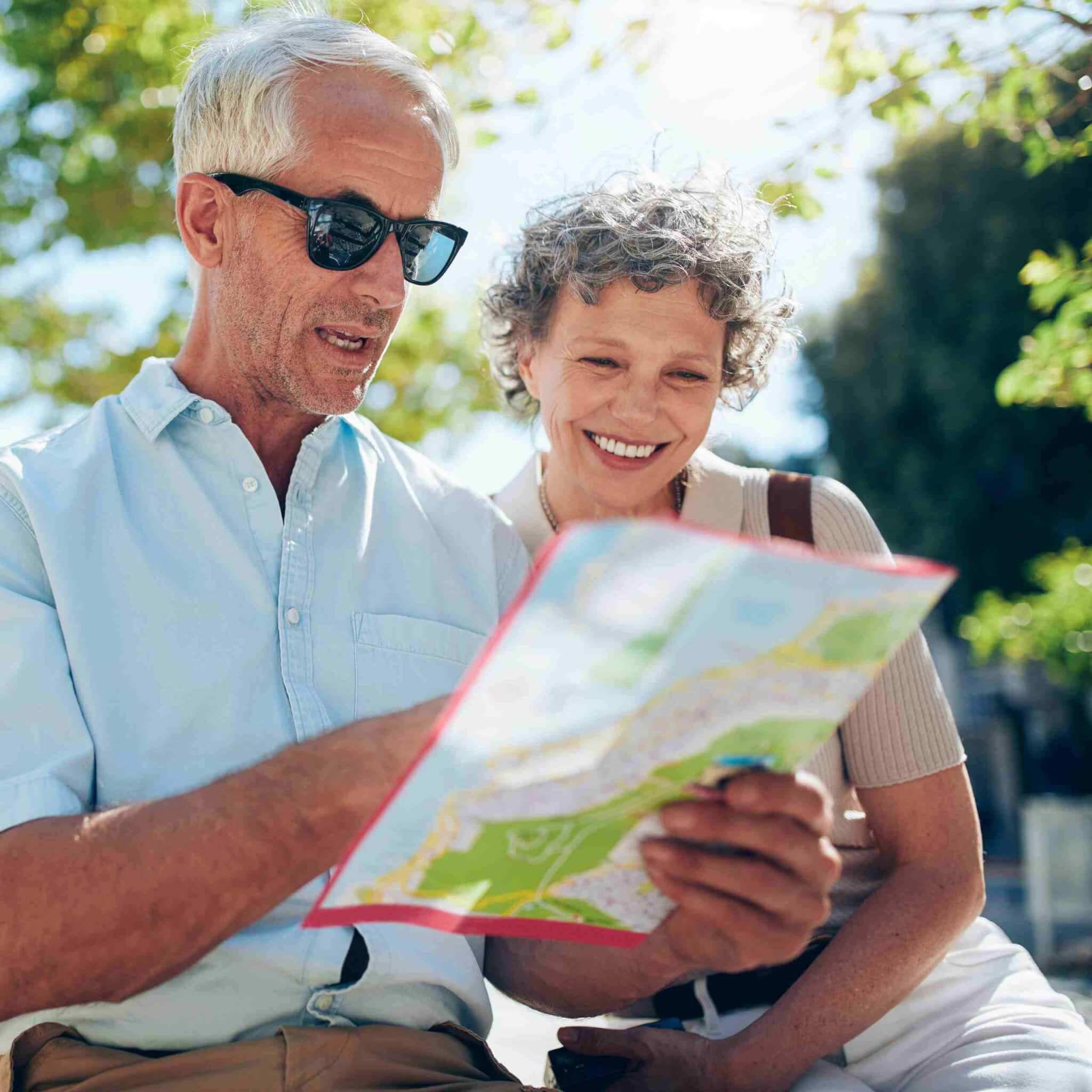 Senior couple looking for a destination on a city map