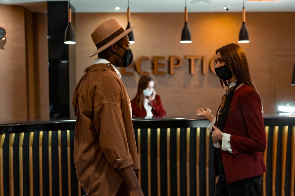 A man and a woman talking at the reception area