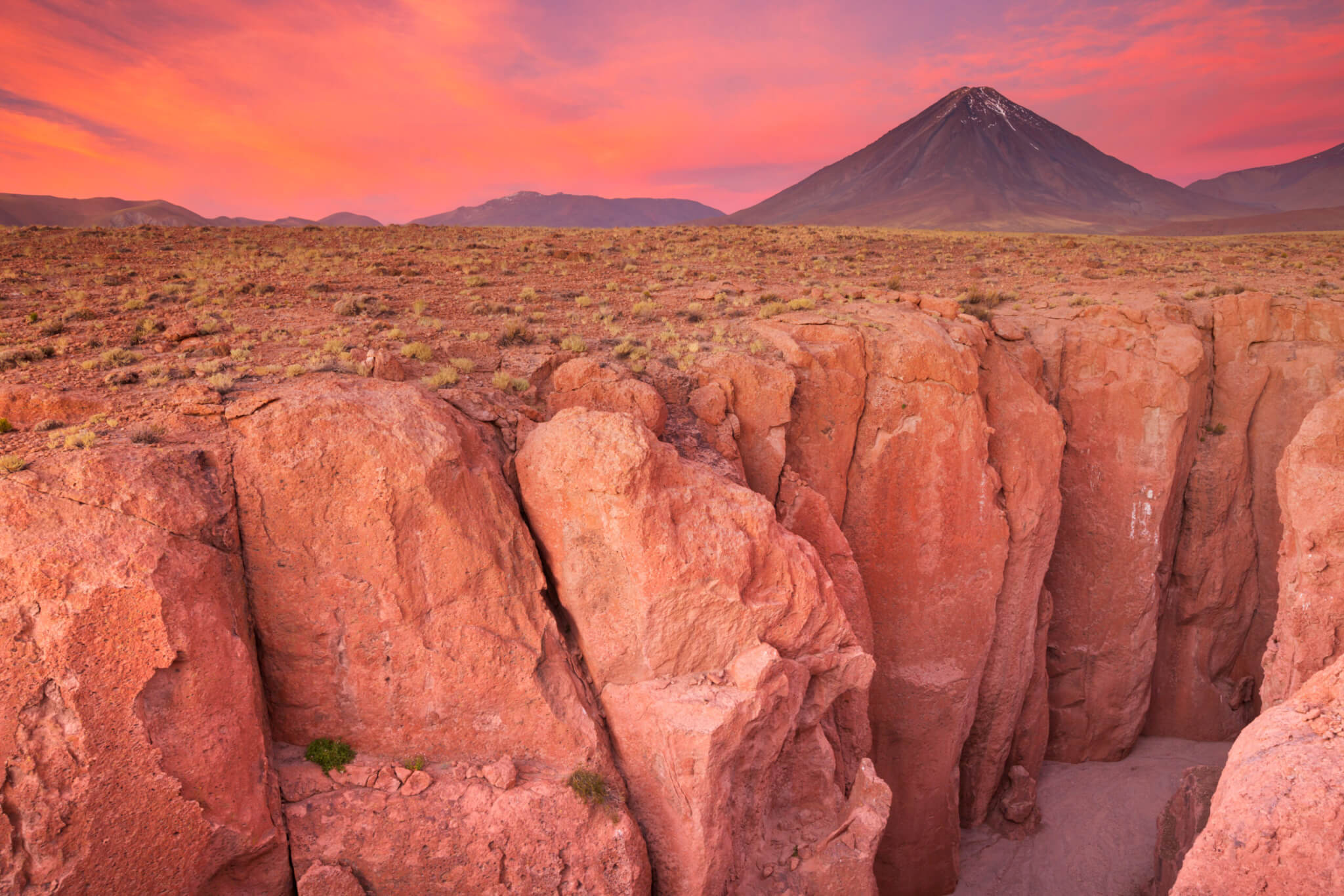 Canyon and Volcan Licancabur, Atacama Desert, Chile at sunset
