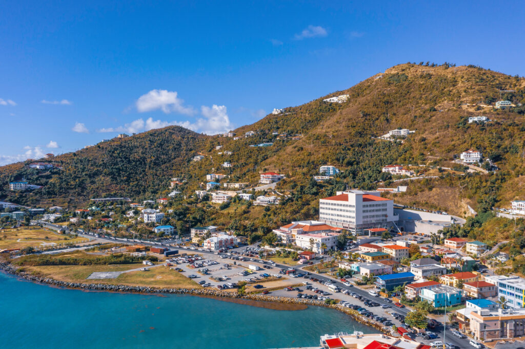 Scenic aerial view of capital of British Virgin Islands Tortola. Beautiful sunny summer landscape of little tropical islands in Caribbean sea. Look of port of small town on green hills.